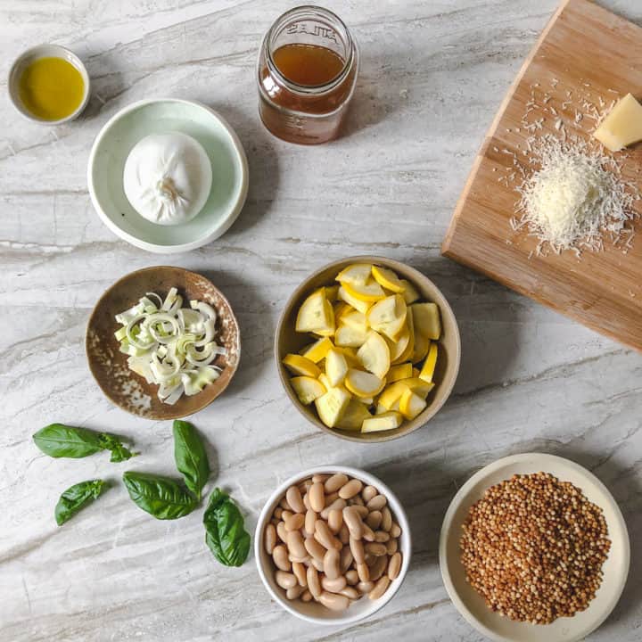 Overhead shot of ingredients in bowls on a marble background