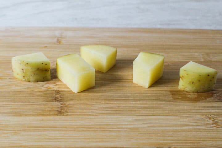 Diced potatoes on cutting board