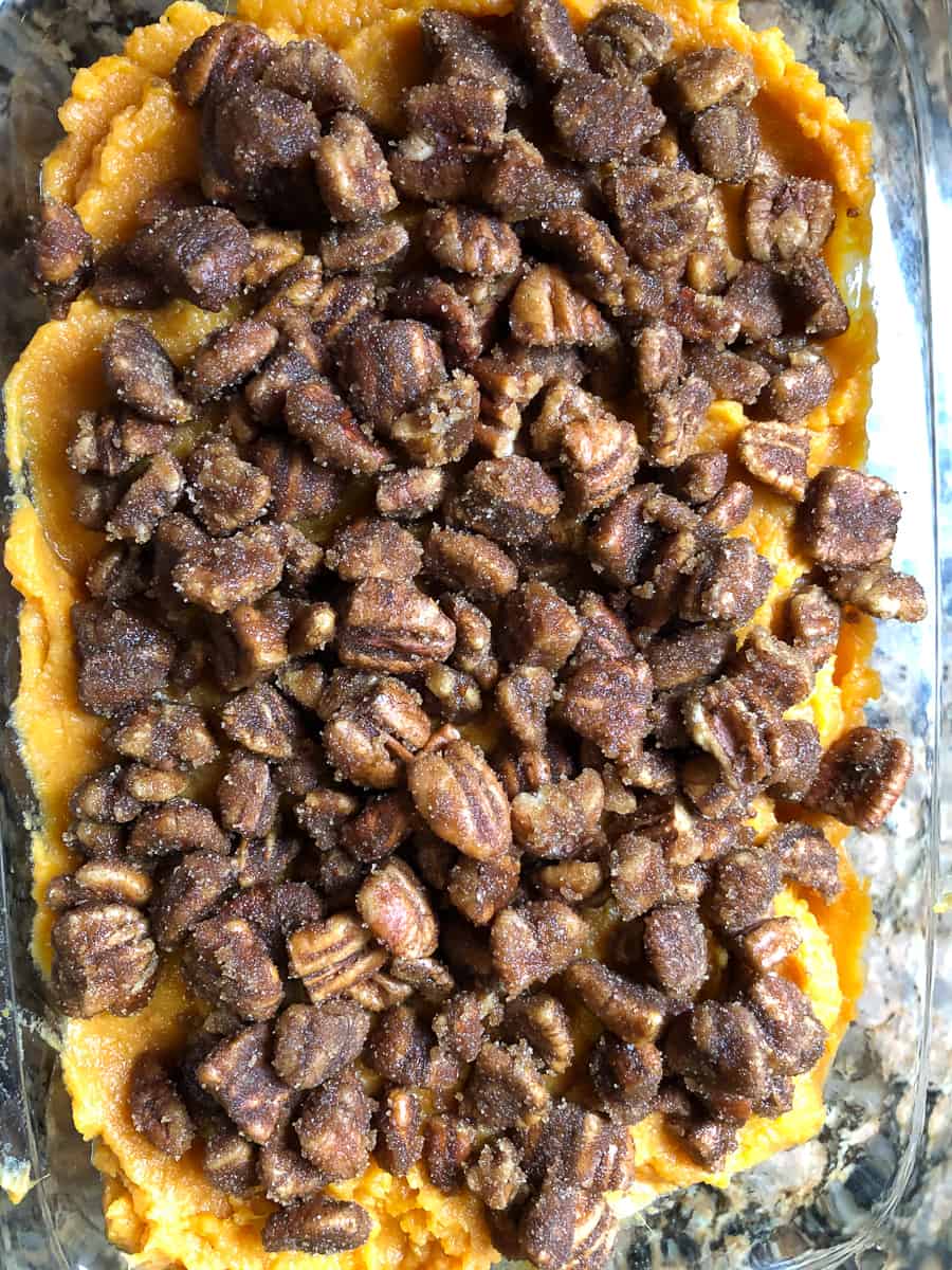 Pecan topping on sweet potatoes before it is baked