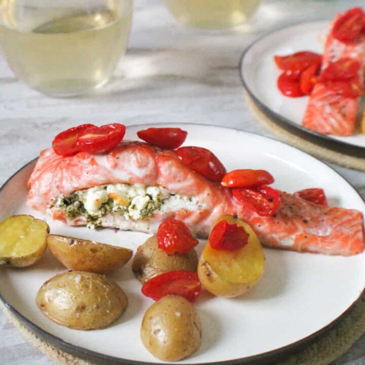 One Pan Salmon and Goat Cheese with tomatoes on a plate