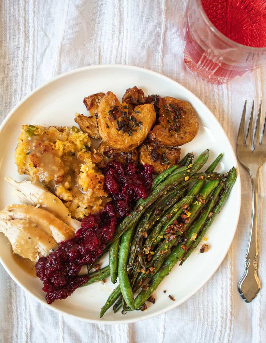 Overhead shot of Sheet Pan Thanksgiving dinner on plate beside a fork
