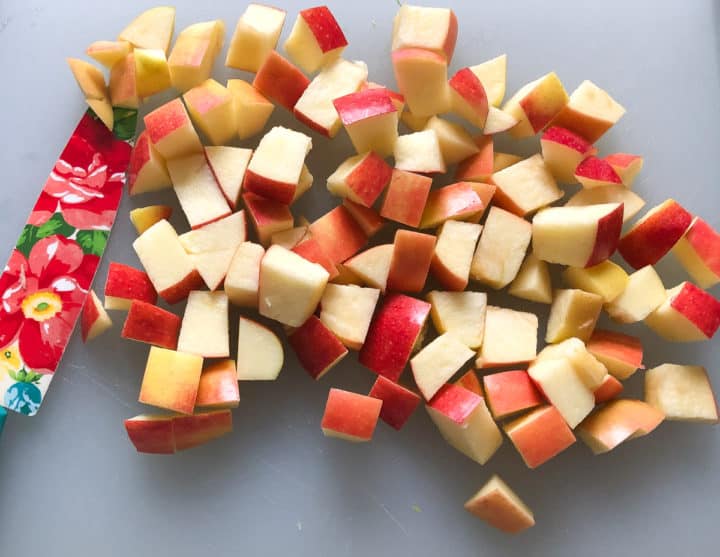 diced apples next to knife