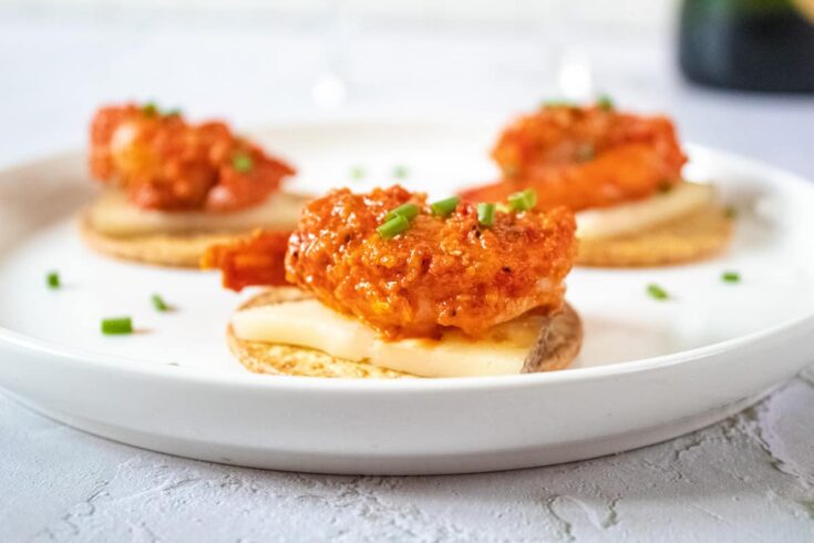 close up head on shot of Romesco Shrimp with Spanish Cheese and Crackers
