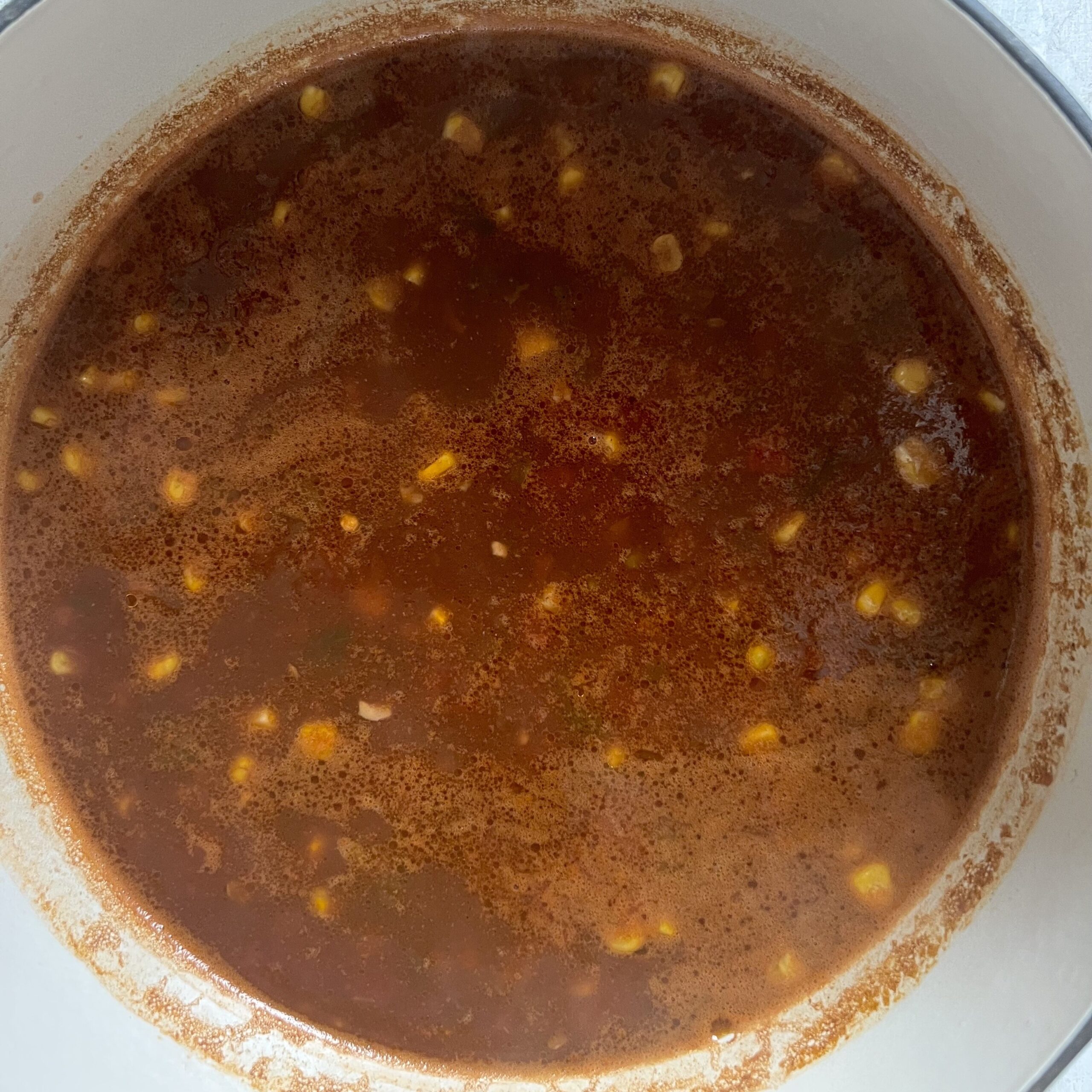 Closeup of a white pot of finished easy black bean chili